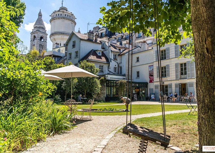 Montmartre museum Café Renoir, Musée de Montmartre's lush summer terrace ... photo